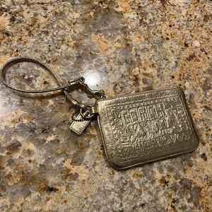 Gold metallic Coach wristlet